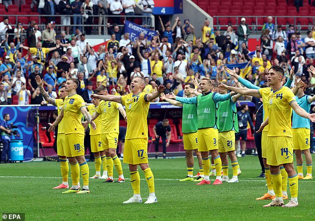 The Ukraine players embraced their fans as they celebrated the landmark victory together