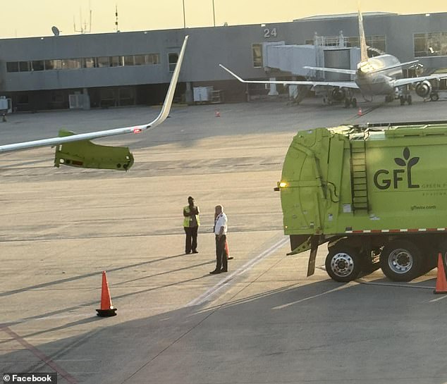 An American Airlines plane was struck by a garbage truck while passengers were waiting to take off in North Carolina .