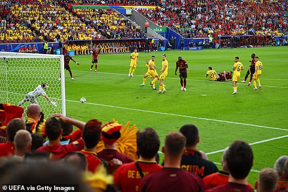 COLOGNE, GERMANY - JUNE 22: Youri Tielemans of Belgium scores his team's first goal as Florin Nita of Romania fails to make a save during the UEFA EURO 2024 group stage match between Belgium and Romania at Cologne Stadium on June 22, 2024 in Cologne, Germany. (Photo by Alexander Scheuber - UEFA/UEFA via Getty Images)