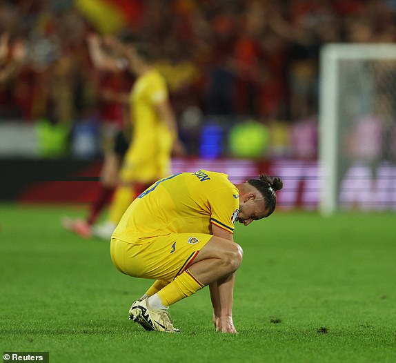 Soccer Football - Euro 2024 - Group E - Belgium v Romania - Cologne Stadium, Cologne, Germany - June 22, 2024 Romania's Radu Dragusin looks dejected after the match REUTERS/Thilo Schmuelgen