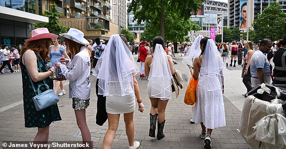 Mandatory Credit: Photo by James Veysey/Shutterstock (14553899d) Taylor Swift fans wearing veils ahead of the concert Fans attending Taylor Swift in concert, Eras Tour at Wembley Stadium, London, UK - 23 Jun 2024