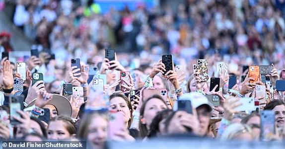 Mandatory Credit: Photo by David Fisher/Shutterstock (14527995ak) Fans on crowd filming on mobile phones Taylor Swift in concert, Murrayfield Stadium, Edinburgh, Scotland, UK - 07 Jun 2024