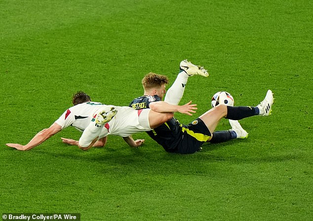 Scotland midfielder Stuart Armstrong (right) was brought down in the box by Willi Orban (left)