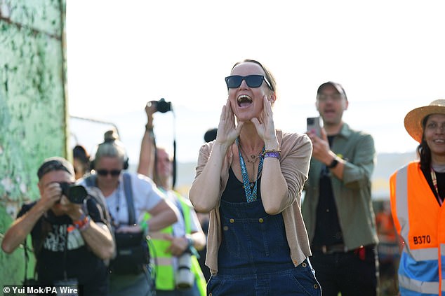 Emily Eavis opens the gates on the first day of the Glastonbury Festival at Worthy Farm in Somerset