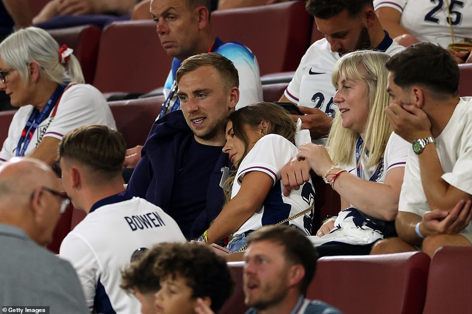 Stunning Dani Dyer, who donned a white England shirt, sympathetically leaned on her partner Jarrod Bowen following the game as they appeared to engage in a serious conversation.