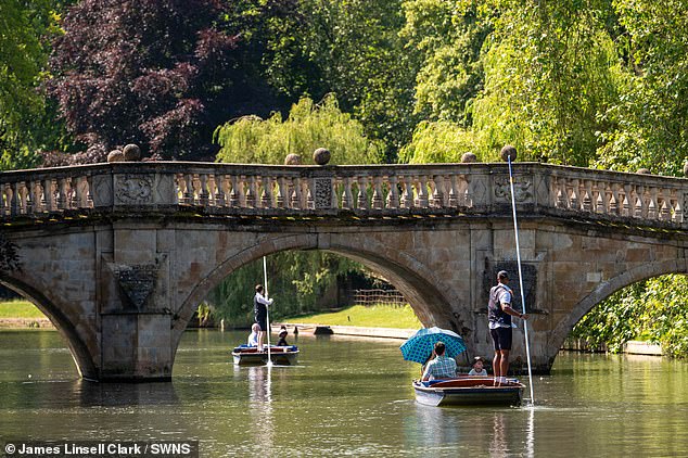 Punters taking tourists along the River Cam in Cambridge