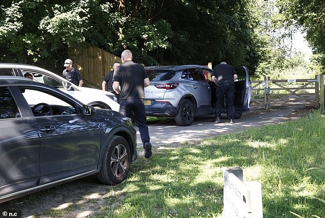 Officials were seen making their way through the gates into the sprawling property