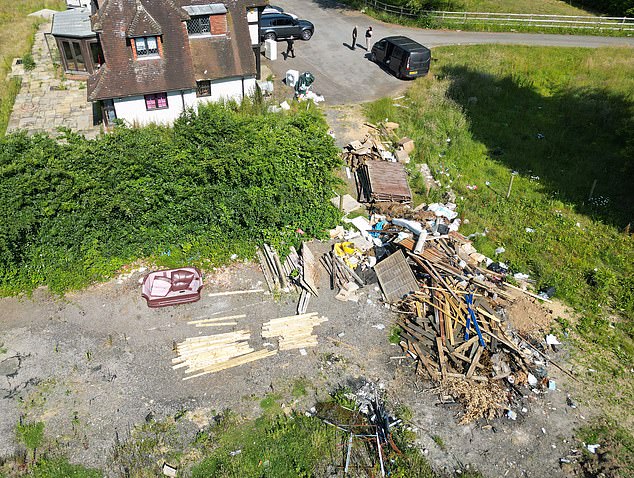 Piles of building materials were also seen at the home after years of renovations