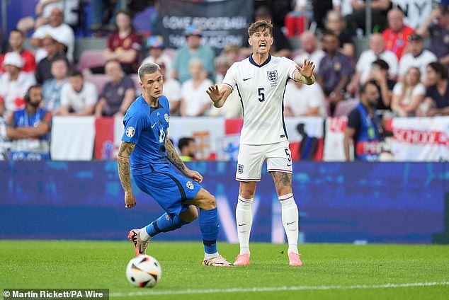 John Stones provides animated instructions to a team-mate after passing the ball under pressure