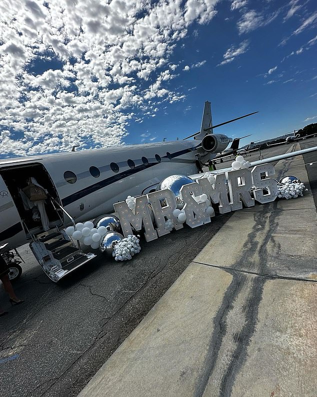 Outside the plane was a sign that read Mr & Mrs