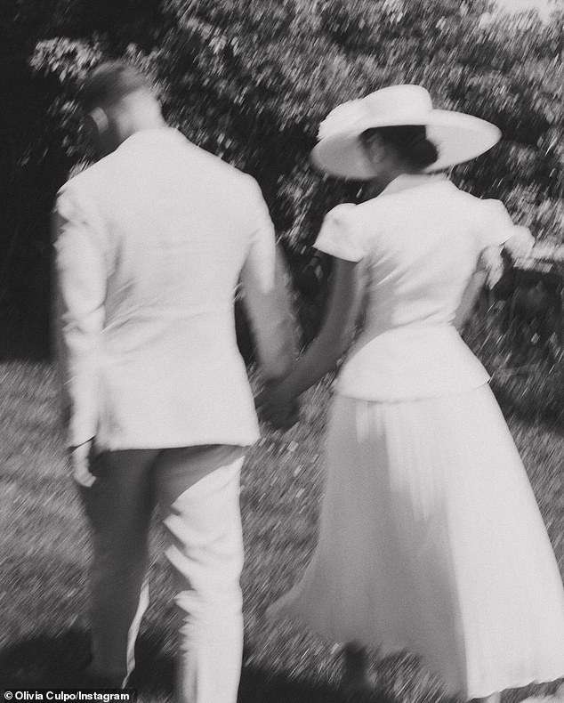 There was also an image of the two holding hands as they walked on a lawn
