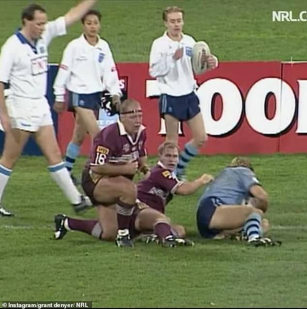 The 46-year-old Deal or No Deal host acted as a ball boy during the notorious clash between the Blues and Maroons at the MCG in 1995.Pictured: Grant is seen on the sideline, far right, during one match in the series