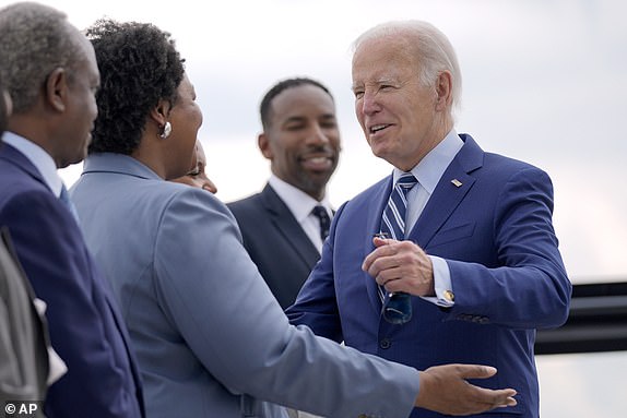 Stacey Abrams, former State House of Representatives Minority Leader, former State House of Representatives Minority Leader, second left, greets President Joe Biden, right, as he arrives at Dobbins Air Reserve Base, Thursday, June 27, 2024, in Marietta, Ga., en route to Atlanta to attend the presidential debate. (AP Photo/Evan Vucci)