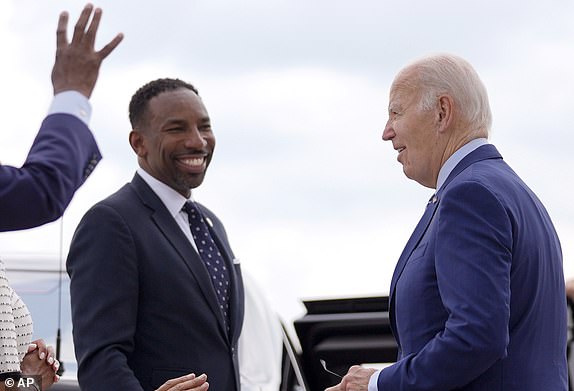 Atlanta Mayor Andre Dickens, left, greets President Joe Biden as Biden arrives at Dobbins Air Reserve Base, Thursday, June 27, 2024, in Marietta, Ga., en route to Atlanta to attend the presidential debate. (AP Photo/Evan Vucci)