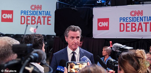 California Governor Gavin Newsom (D) speaks with members of the press on the day of the first presidential debate hosted by CNN in Atlanta, Georgia, U.S., June 27, 2024. REUTERS/Marco Bello