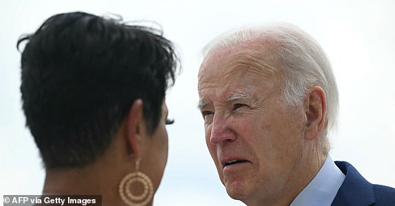 CORRECTION / US President Joe Biden speaks with Sandra Williams of the North Georgia Labor Council upon arrival at Dobbins Air Reserve Base in Mariette, Georgia, on June 27, 2024, as he travels to Atlanta for the first 2024 presidential debate. (Photo by Mandel NGAN / AFP) / "The erroneous mention[s] appearing in the metadata of this photo by Mandel NGAN has been modified in AFP systems in the following manner: [Sandra Williams of the North Georgia Labor Council] instead of [former Atlanta mayor Keisha Lance Bottoms]. Please immediately remove the erroneous mention[s] from all your online services and delete it (them) from your servers. If you have been authorized by AFP to distribute it (them) to third parties, please ensure that the same actions are carried out by them. Failure to promptly comply with these instructions will entail liability on your part for any continued or post notification usage. Therefore we thank you very much for all your attention and prompt action. We are so