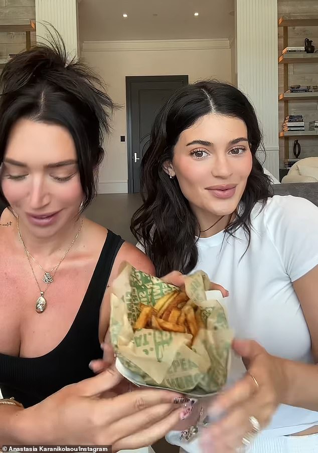 Kylie explained, 'Stass is making me eat Wingstop,' with the YouTuber showing a dish of warm fries to the camera