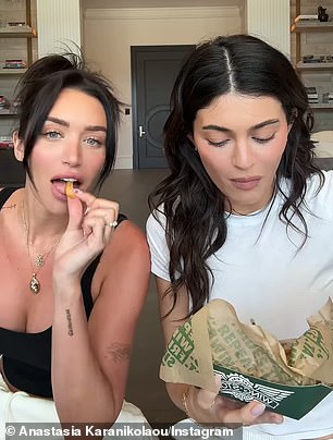 'Oh! Mukbang girls are back!' Jenner continued as they both munched on a few fries from the restaurant