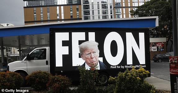 ATLANTA, GEORGIA - JUNE 27: A truck displays large images of former President Donald Trump in the downtown area on June 27, 2024 in Atlanta, Georgia. Supporters of President Joe Biden and former President Donald Trump will gather near the CNN campus where both candidates will have their first debate. (Photo by Octavio Jones/Getty Images)