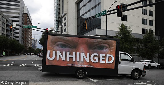 ATLANTA, GEORGIA - JUNE 27: A truck displays large images of former President Donald Trump in the downtown area on June 27, 2024 in Atlanta, Georgia. Supporters of President Joe Biden and former President Donald Trump will gather near the CNN campus where both candidates will have their first debate. (Photo by Octavio Jones/Getty Images)