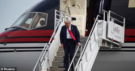 Republican presidential candidate and former U.S. President Donald Trump arrives for the first 2024 presidential debate with U.S. President Joe Biden, hosted by CNN in Atlanta, at Hartsfield-Jackson Atlanta International Airport, Georgia, U.S., June 27, 2024.  REUTERS/Megan Varner