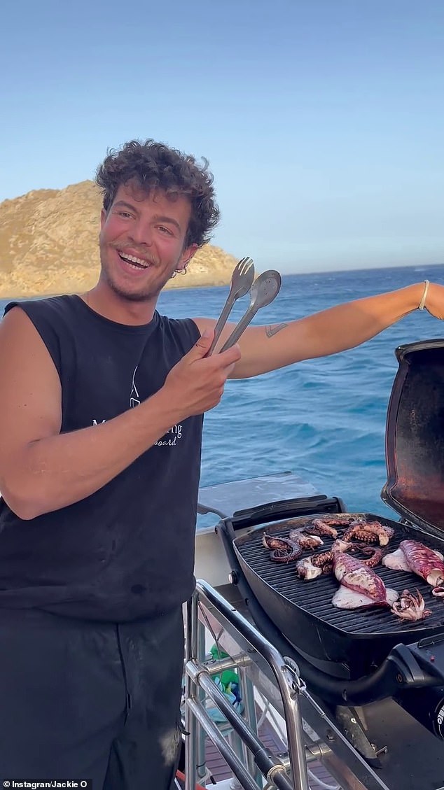 A mystery hunk was seen showing off his culinary skills, grilling up a storm on the boat¿s BBQ