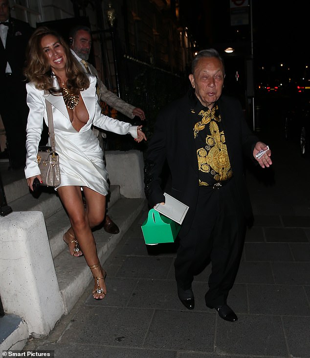 The Real Housewives of Cheshire star, 42, towered over David, 75, as they left the lavish venue in high spirits after enjoying a romantic date night