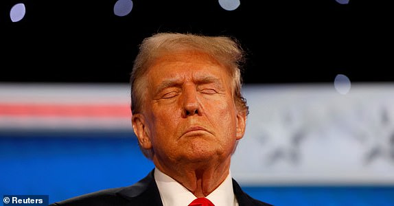 Republican presidential candidate and former U.S. President Donald Trump attends the first presidential debate hosted by CNN in Atlanta, Georgia, U.S., June 27, 2024. REUTERS/Marco Bello