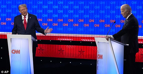 President Joe Biden, right, and Republican presidential candidate former President Donald Trump, left, participate in a presidential debate hosted by CNN, Thursday, June 27, 2024, in Atlanta. (AP Photo/Gerald Herbert)