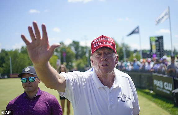 FILE - Former President Donald Trump greets supporters and sign autographs during the final round of the Bedminster Invitational LIV Golf tournament at his golf course in Bedminster, N.J., Aug. 13, 2023. On Monday, June 10, 2024, the New Jersey Attorney General's Office said it is looking into whether the former president's 34 felony convictions in a New York case might affect his continued ability to hold liquor licenses for this three New Jersey golf courses. (AP Photo/Seth Wenig, File)