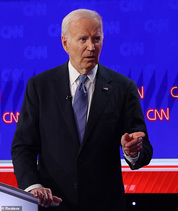 Democrat candidate, U.S. President Joe Biden, points during a presidential debate with Republican candidate, former U.S. President Donald Trump, in Atlanta, Georgia, U.S., June 27, 2024. REUTERS/Brian Snyder