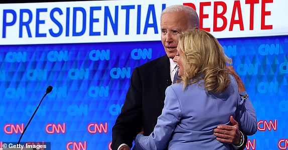 ATLANTA, GEORGIA - JUNE 27: U.S. President Joe Biden embraces first lady Jill Biden following the CNN Presidential Debate at the CNN Studios on June 27, 2024 in Atlanta, Georgia. President Biden and Republican presidential candidate, former U.S. President Donald Trump are facing off in the first presidential debate of the 2024 campaign. (Photo by Justin Sullivan/Getty Images)