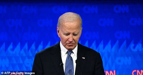 TOPSHOT - US President Joe Biden looks down as he participates in the first presidential debate of the 2024 elections with former US President and Republican presidential candidate Donald Trump at CNN's studios in Atlanta, Georgia, on June 27, 2024. (Photo by ANDREW CABALLERO-REYNOLDS / AFP) (Photo by ANDREW CABALLERO-REYNOLDS/AFP via Getty Images)