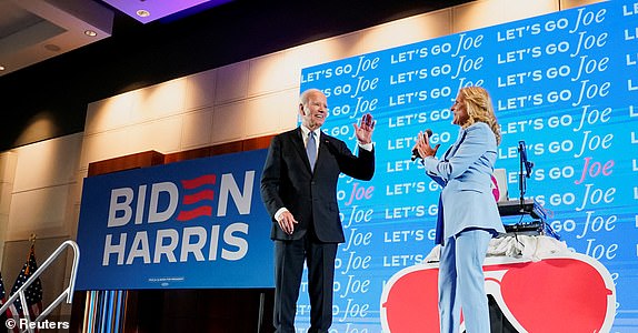 U.S. President Joe Biden and U.S. First Lady Jill Biden gesture as they speak to supporters at a debate night watch party after participating in the first presidential debate hosted by CNN in Atlanta, Georgia, U.S., June 27, 2024. REUTERS/Elizabeth Frantz