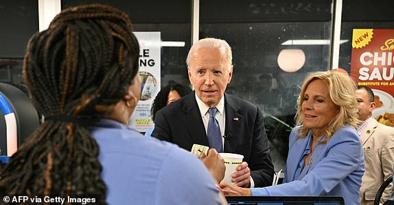 US President Joe Biden (L) and US First Lady Jill Biden make a purchase as they visit a Waffle House in Marietta, Georgia, after Biden participated in the first presidential debate of the 2024 elections, on June 27, 2024. (Photo by Mandel NGAN / AFP) (Photo by MANDEL NGAN/AFP via Getty Images)