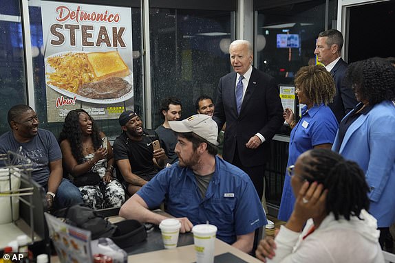 President Joe Biden greets supporters at a Waffle House in Marietta, Ga., Friday, June 28, 2024, following a presidential debate in Atlanta. (AP Photo/Evan Vucci)