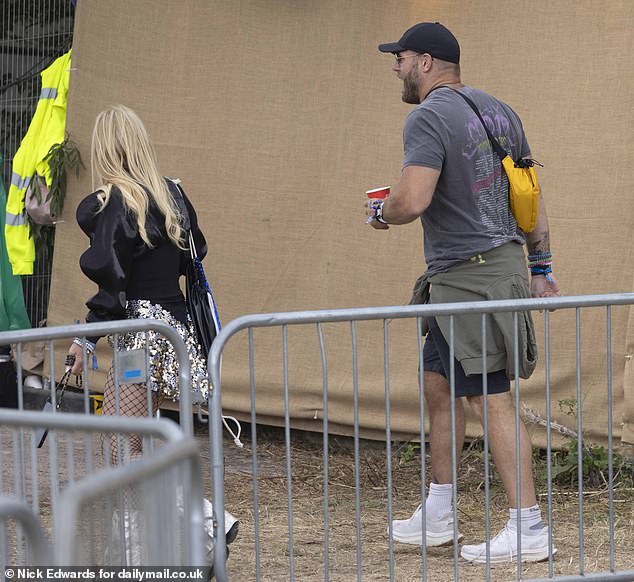 James kept his essentials in a cross body bag and accessorised with beaded bracelets and colourful manicure