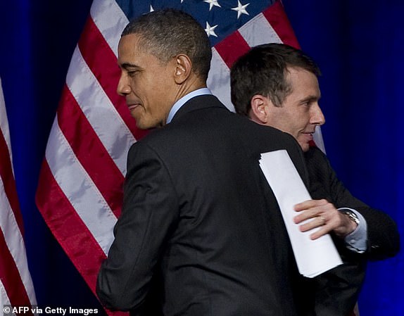 US President Barack Obama greets senior advisor and former campaign manager David Plouffe (L) during a Democratic National Committee (DNC) event in Washington, DC, March 16, 2011. AFP PHOTO / Saul LOEB (Photo credit should read SAUL LOEB/AFP via Getty Images)