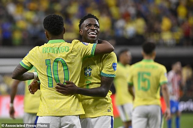 Brazil's Vinicius Junior (R) celebrates with teammate Rodrygo after scoring his side's third goal