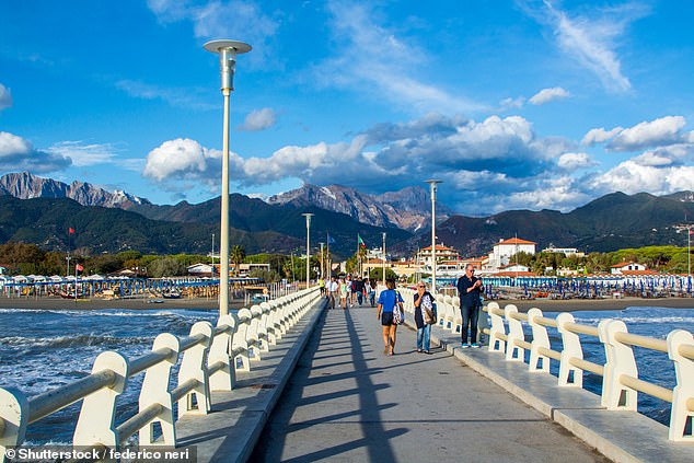 Kate explores the resort's pier (pictured), which stretches 275m into the Ligurian Sea