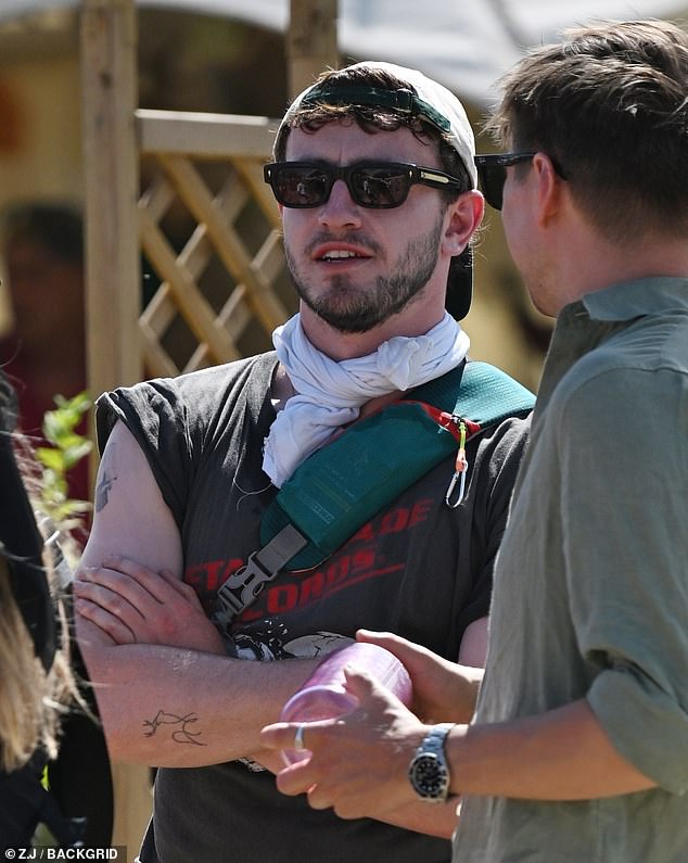 Later in the day Paul slipped into a stylish festival ensemble as he partied with pals