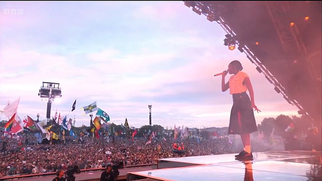 The inflatable dinghy can be seen near the front of the crowd during Little Simz's performance