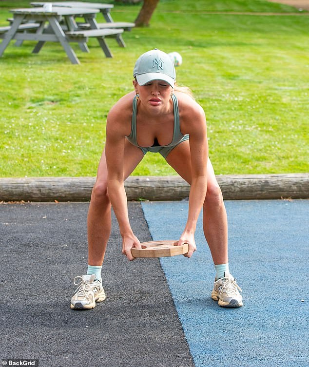 The stunner lifted dumbbells and dial weights in the sunshine before later jogging around the park