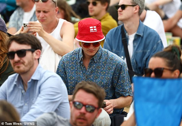 England fans pictured at the Glastonbury Festival today in their football merch