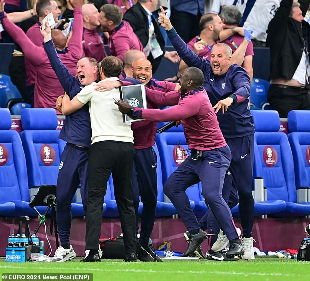 Southgate, in the white top, joined coaching staff in ecstatic stoppage-time touchline scenes