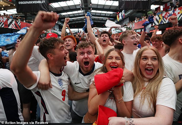 LONDON -- England fans at Boxpark celebrate after Jude Bellingham scores