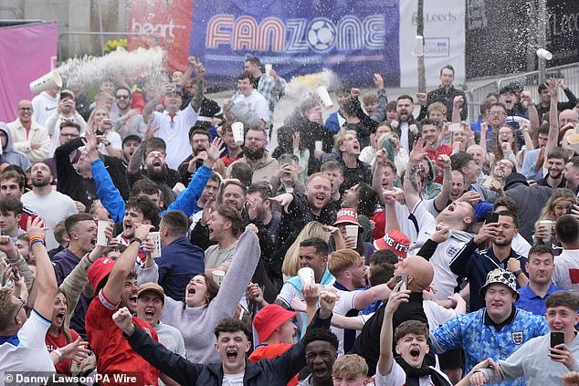 England fans celebrate at Millennium Square in Leeds as the Three Lions went through to the quarter finals in dramatic fashion