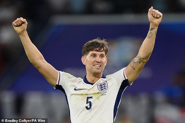 Jon Stones celebrates at the final whistle after a hard-earned victory against Slovakia