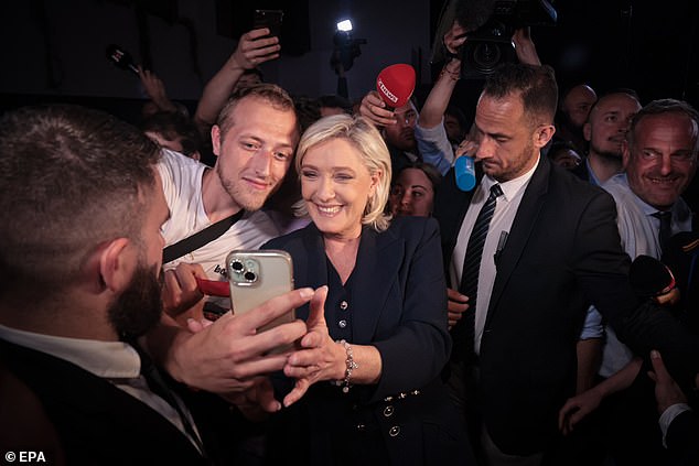 Marine Le Pen (C), the candidate for the National Rally party, with supporters at the end of the French election day in Paris, France, 01 July 2024