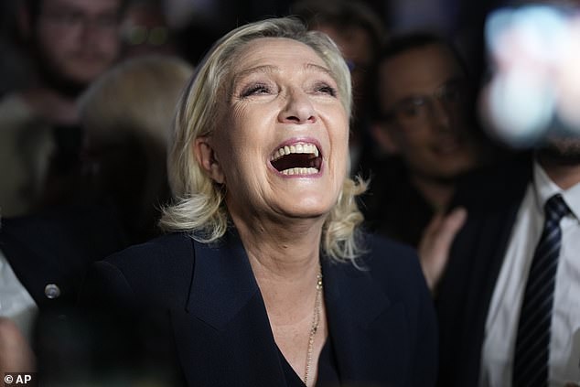 RN leader Marine Le Pen reacts as she meets supporters and journalists after the release of projections based on the actual vote count in select constituencies, Sunday, June 30, 2024 in Henin-Beaumont, northern France